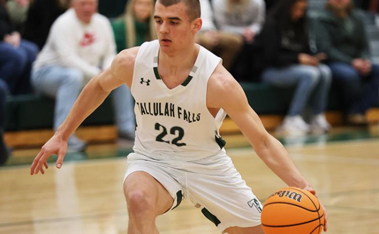 Zakhar Valasiuk dribbles down the court. FILE