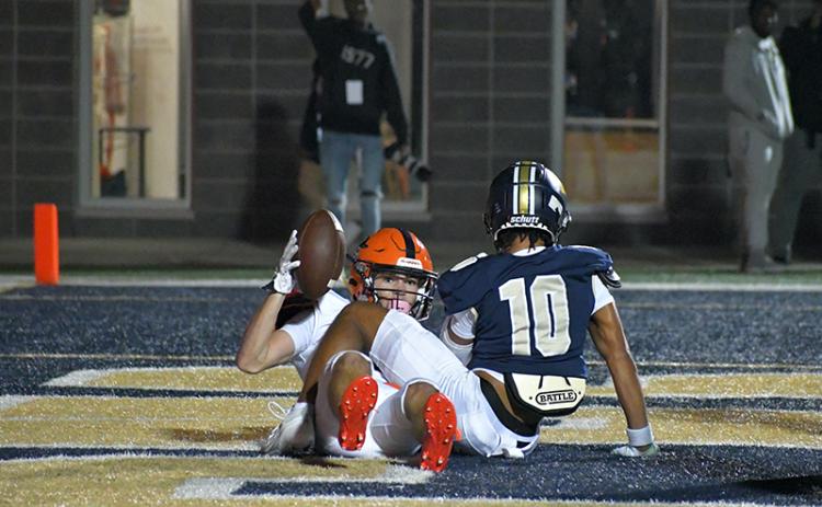 Habersham Central’s Zeke Whittington shows the ball after snagging a touchdown catch in the first half of Friday’s playoff loss to Douglas County. Whittington, a junior, finished the season with 221 career catches, the most in Habersham Central history so far. LANG STOREY/Staff
