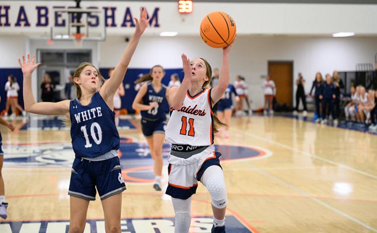 Kylie Littlejohn goes up for a layup while being heavily guarded. ZACH TAYLOR/Special