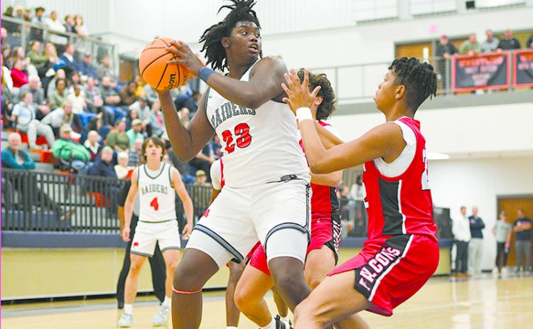 JoJo McCurry begins to drive toward the net in the Flowery Branch matchup. TOM ASKEW/Special