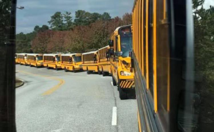 Habersham County School buses lineup to pick up students. SUBMITTED