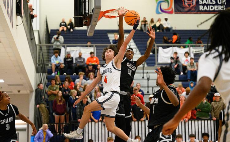 Shiloh’s Tylis Jordan gets his hand caught in the net trying to block Habersham Central’s Brannon Gaines during Wednesday’s game. ZACH TAYLOR/Special
