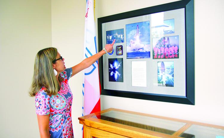 Tallulah Falls School Upper School Academic Dean Kim Popham observes the many keepsakes reminiscing when students and faculty won the opportunity to travel to the White House. FILE