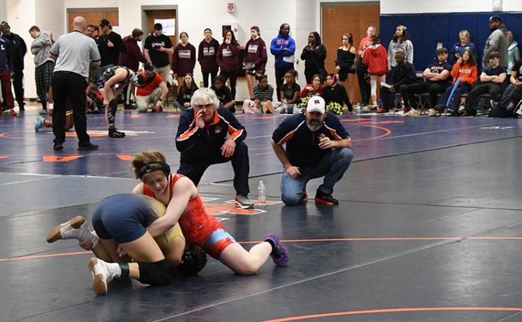Habersham Central coaches Morris Brooks and Len King instruct McKenzie Spradley at the state sectional meet Friday. LANG STOREY/Staff