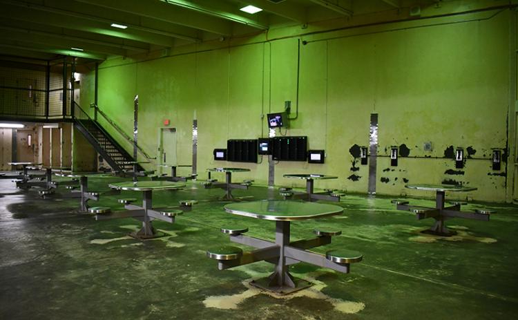 Shown is the day area of a block at the Habersham County jail where inmates can make phone calls, use tablets to take rehabilitation courses, or socialize. JULIANNE AKERS/Staff