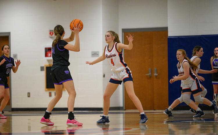 Lady Raiders senior Sophie Bramlett gets set on defense against North Forsyth on Friday night. More Senior Night pics, pages 4-5B. ZACH TAYLOR/Special