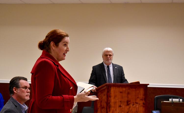 Vertical Bridge attorney Mattaniah Jahn (front) rebuts a point made by Ralph Taylor who represents the county with Hunt & Taylor Law Group. JULIANNE AKERS/Staff