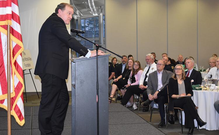 Judge Brian Rickman speaks fondly of American Values Distinguished Citizen honoree Sheriff Joey Terrell (white uniform, shown listening with wife Darlene and daughter Katie) during Tuesday night’s event. MATTHEW OSBORNE/Staff
