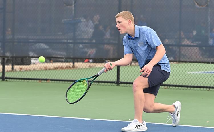 Habersham Central’s Lije Smith returns a shot during a recent home match. LANG STOREY/Staff