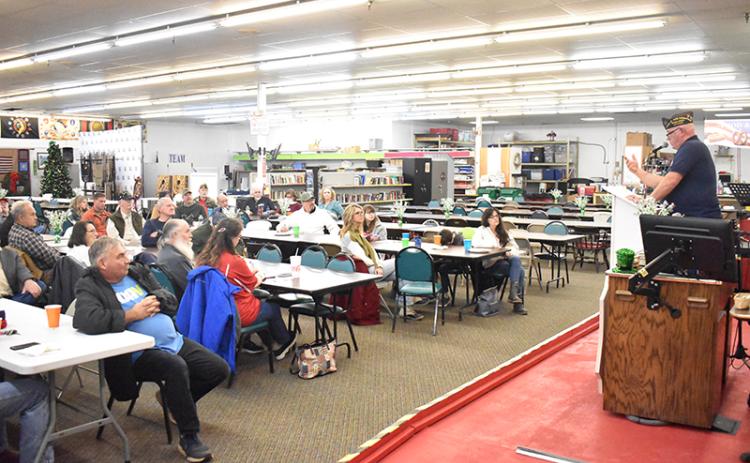 VFW Commander Bill Miles addresses the crowd at a town hall meeting Friday night in Cornelia. MATTHEW OSBORNE/Staff