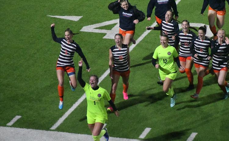 Habersham Central’s girls soccer team runs to the stands to acknowledge the crowd that sat through 100 minutes of rain and wind to watch them earn a program-altering 2-1 win over Jackson County on Friday. Scan above for Tuesday’s match results. MATTHEW OSBORNE/Staff