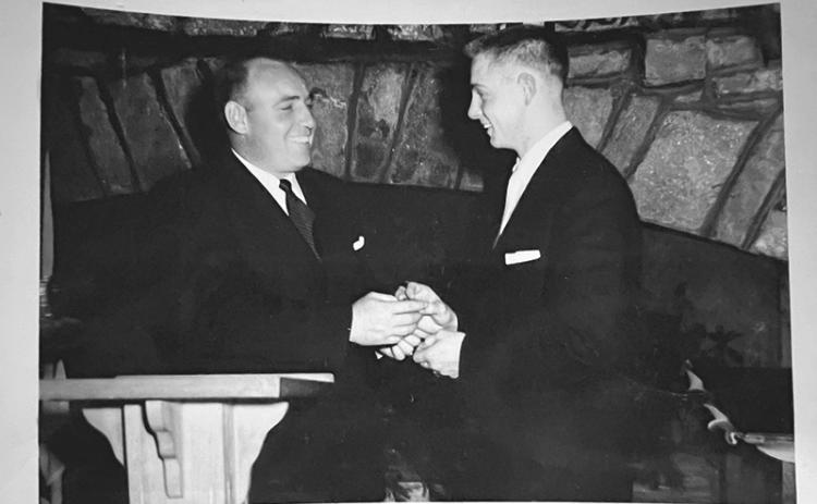 Coach Gene Alexander  hands Herman Benfield his All-Region award during a banquet  following the season. SUBMITTED