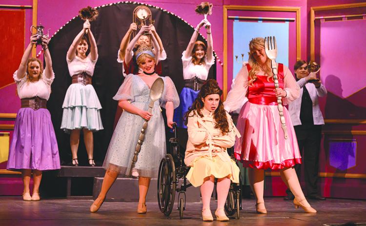 Belle, played by Lilly Kate Farrar, sings about her frustrations with dancing dishes and silverware as an ensemble during “Disenchanted” at Habersham Community Theater. ZACH TAYLOR/Special