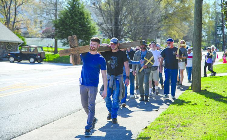 Reid Jones and David Lanton carry the cross. ZACH TAYLOR/Special