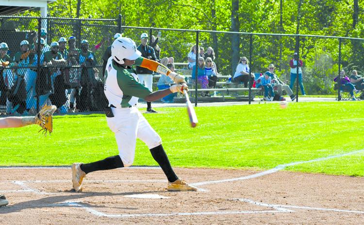 Tallulah Falls’ Caden Walker turns on a pitch in the Indians’ game 1 win Tuesday. LANG STOREY/Staff