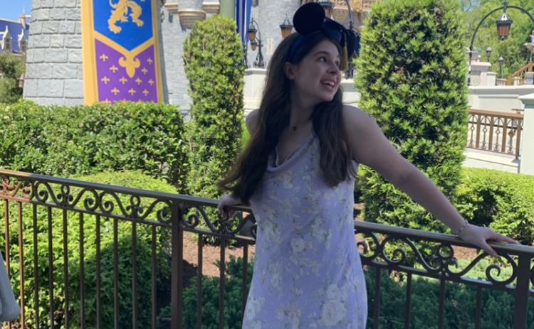 Lilly Kate Farrar stands in front of Cinderella’s castle in Disney World during Disney Dreamers Academy. SUBMITTED