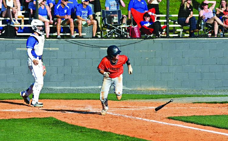 Maverick Chitwood busts it out of the batters box after grounding into a fielder’s choice  during Wednesday’s playoff game at Etowah. LANG STOREY/Staff