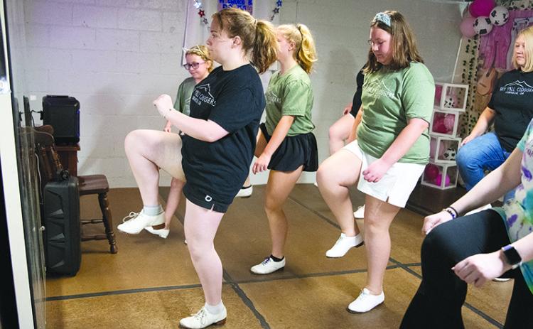 From left, Delaney Shirah leads clogging class in Cornelia with Emma  Grace McDuffie, Regan George and AnnaReese George. ZACH TAYLOR/Special