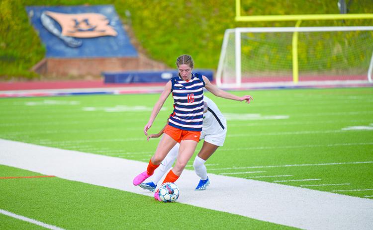 Abigail Hotard flicks the ball upfield to Meg LaBarbera. ZACH TAYLOR/Special