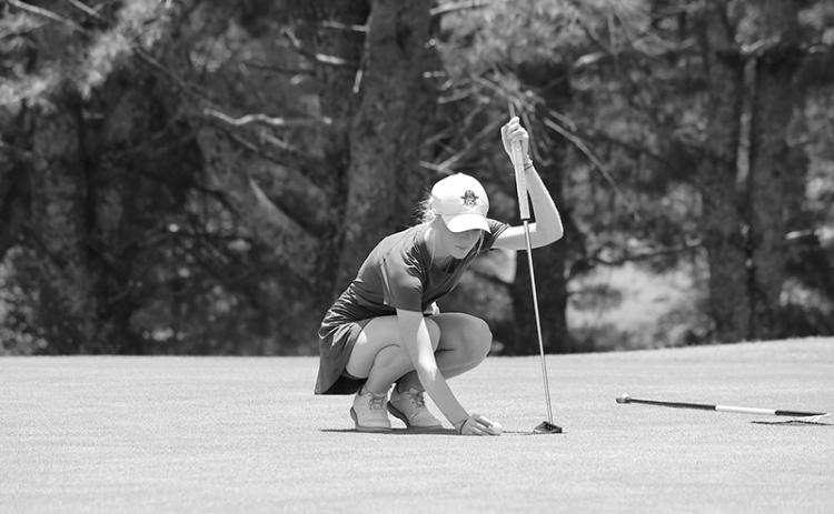Addie Maney lines up a putt during Round 1 at Apple Mountain. LANG STOREY/Staff