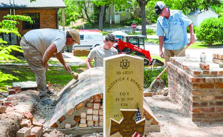 From left: Alton Fry, Danny McDuffie and Mason Tench with Fry Masonry work on restoring the  Durbec family plot at Old Clarkesville Cemetery. JULIANNE AKERS/Staff