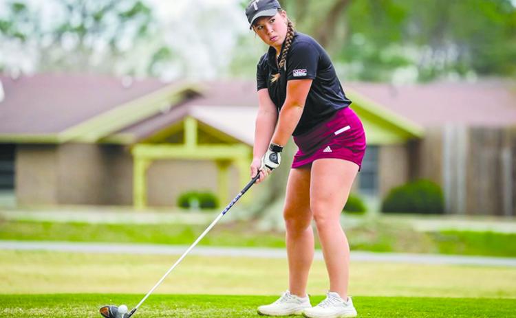 Troy golfer Brinson Hall lines up her drive during a match earlier this year. TROY ATHLETICS/Submitted