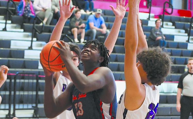 Josiah McCurry gets surrounded by defenders during a game last year. He will get plenty of attention from colleges during his senior year. FILE