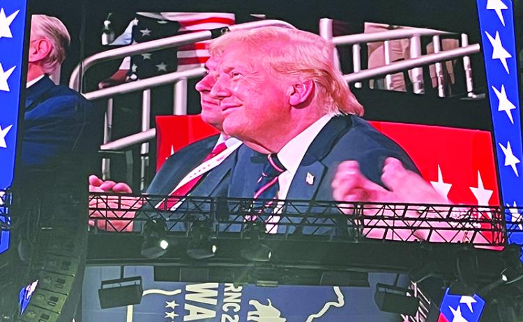 Donald Trump takes in a speech at the Republican National Convention on the big screen. CARL BLACKBURN/Submitted