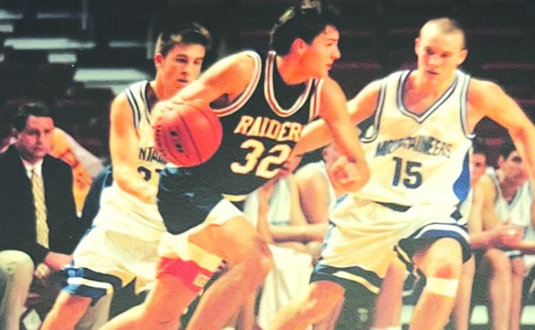 John Lacy drives by a defender at a tournament hosted by the University of Arkansas. FILE