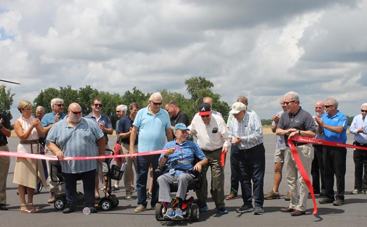 Habersham County Commissioner Jimmy Tench, Dean Swanson, retired Sen. John Foster, Don Higgins and Ken Schubring cut ribbon to celebrate the airport’s new runway Tuesday. BRIAN WELLMEIER/Special
