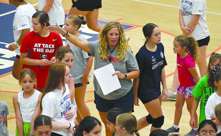 Lady Raiders varsity coach Lindsay Herrin gives instructions at Future Raider Volleyball Camp on Thursday morning. LANG STOREY/Staff