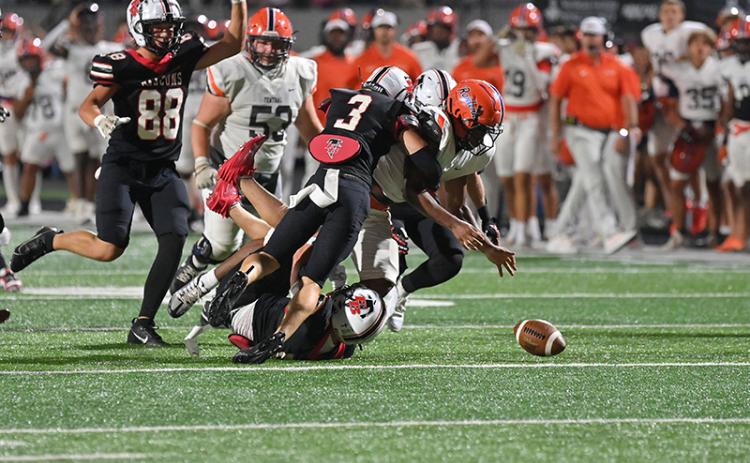 The Raiders had a tough time hanging on to the ball at Flowery Branch. TOM ASKEW/Special