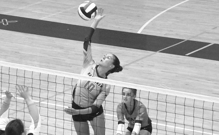 Ava Saxon makes a play at the net at White County on Tuesday. LANG STOREY/Staff