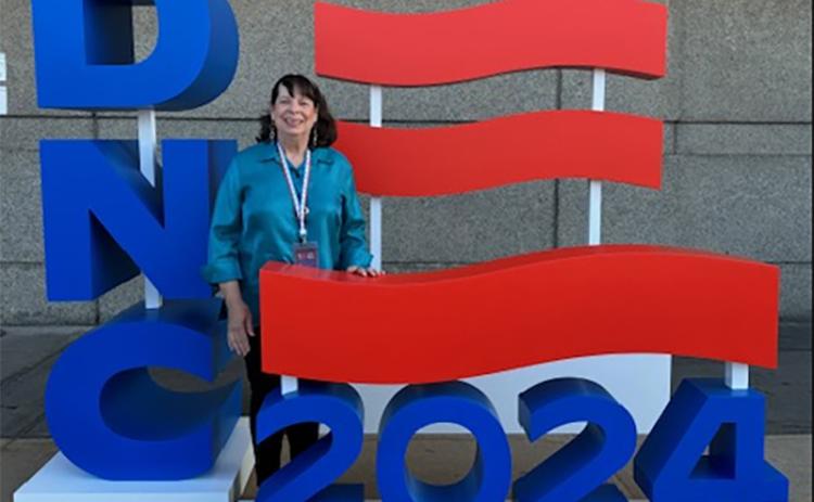 Virginia Webb poses outside of the DNC convention center in Chicago. SUBMITTED