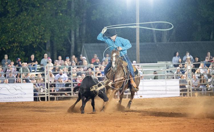 Tyler and Trevor Boatwright set a time of 6.1 to win the weekend in team roping. The brothers were the most cohesive team in the arena on Friday night. Trevor Boatwright is getting the heel toss lined up. ZACH TAYLOR/Staff