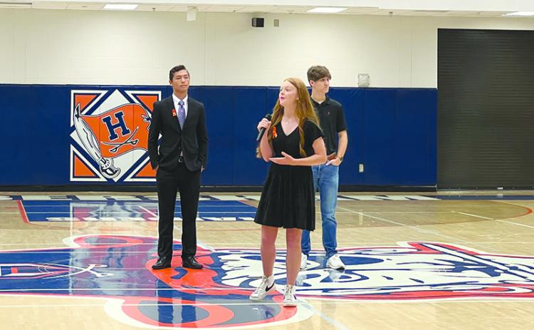 Elloree Chambers, center, addressed more than 200 students at Habersham Central on Sept. 20 in a stand against gun violence. Behind her stand fellow students Isaac McDougal, left, and Jack Garrett, right. SUBMITTED