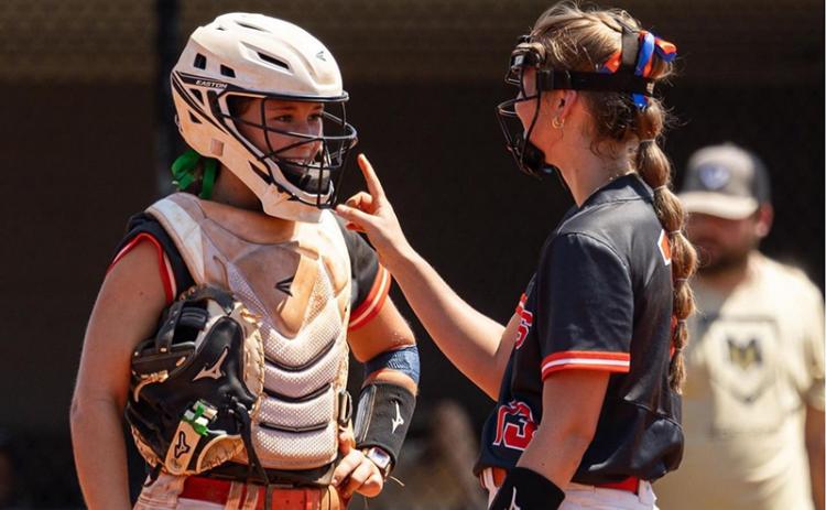Catcher Shelby Rinefierd chats with Kaylan Barrett during a game earlier this season. MEG LABARBERA/HCHS
