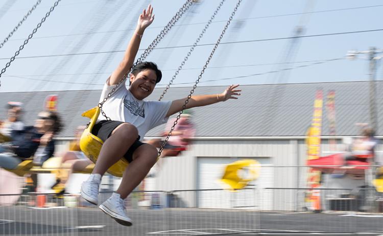 Lucky Tiamtisack goes round and round on the swings with his arms raised in the air. The special education day at the Chattahoochee Mountain Fair is an annual tradition in Habersham County. ZACH TAYLOR/Staff