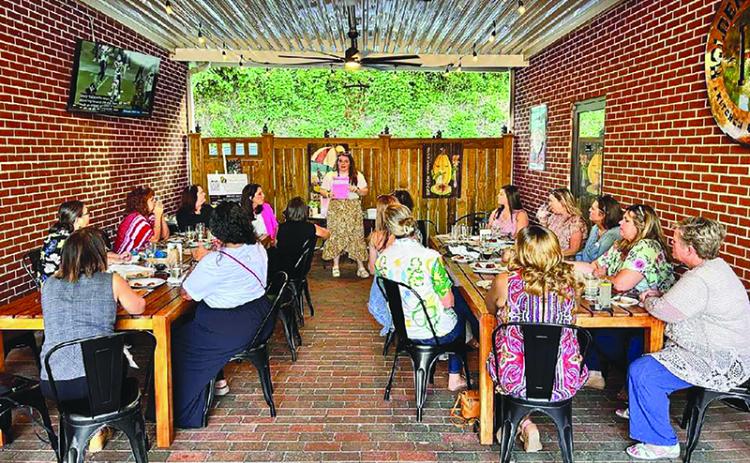 Marcia Hamil leads a discussion at a recent Habersham Professional Women meeting. SUBMITTED