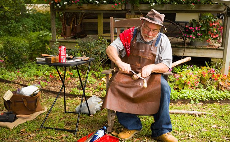 Jeff Blackwell carves into a cane during a previous event at the Mauldin House in Clarkesville. ZACH TAYLOR/Staff