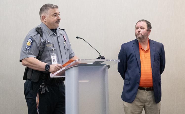Habersham County Schools Director of School Safety Murray Kogod, left, speaks at the board of education’s work session on Tuesday about the benefit of Centegix, a wearable alert system for educators. Right, Assistant Superintendent Patrick Franklin listens. JULIANNE AKERS/Staff