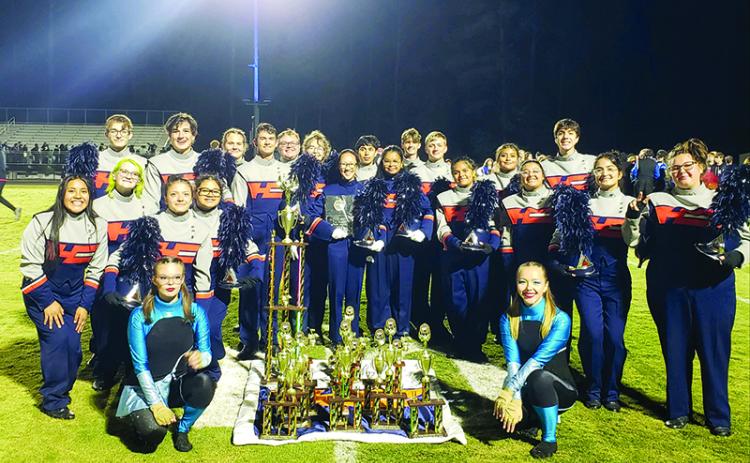 The Band of Blue stands with their hard-earned trophies at the Golden River Marching Festival on Oct. 19. SUBMITTED