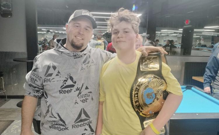 Colston Harrelson (right) and his father Bradley snap a photo after Colston’s big win this past weekend in Alabama. SUBMITTED