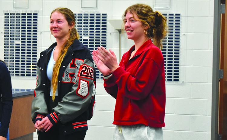 Abigail Hotard (right) claps as her sister, Audrey, is announced Habersham Central High School’s valedictorian Wednesday morning. Abigail was announced as the class salutatorian. Samantha Sinclair/Staff