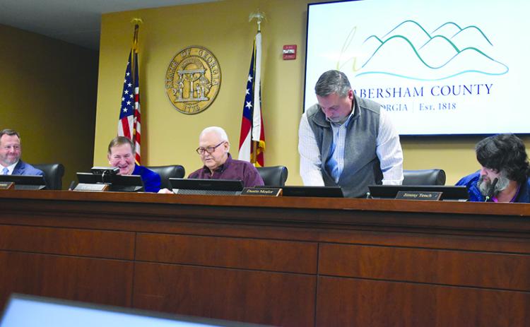 Immediately following the election of chairman, commissioners Jimmy Tench, Ty Akins and Dustin Mealor switched seats so Tench could take his place as chairman. Samantha Sinclair/Staff