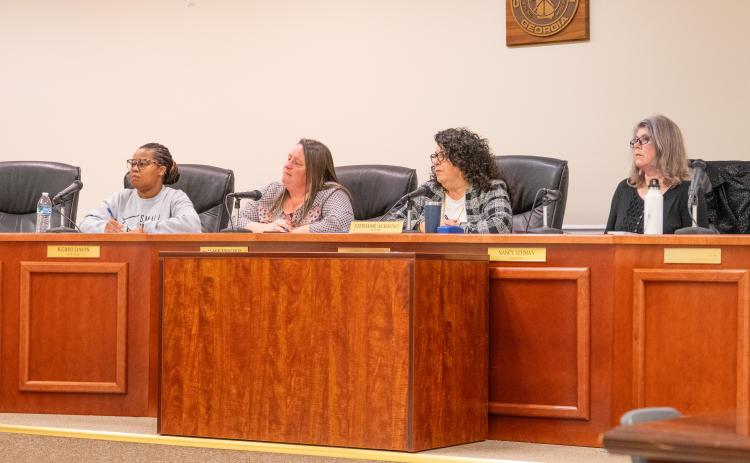 Mayor Stephanie Almagno and Councilwomen Kerri Davis, Alice Venter and Nancy Lehman listen intently to Baldwin Resident Paul Wolf about his garbage disposal issues. ZACH TAYLOR/Staff