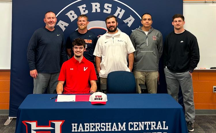 HCHS senior Everett Rudeseal officially put pen to paper last week. Much of the Habersham Football staff - including (from left) Coach Benji Harrison, JR Roberson, Drew Ferguson, Isaiah Murphy and Garrett Kinsey - were in attendance to witness. SUBMITTED
