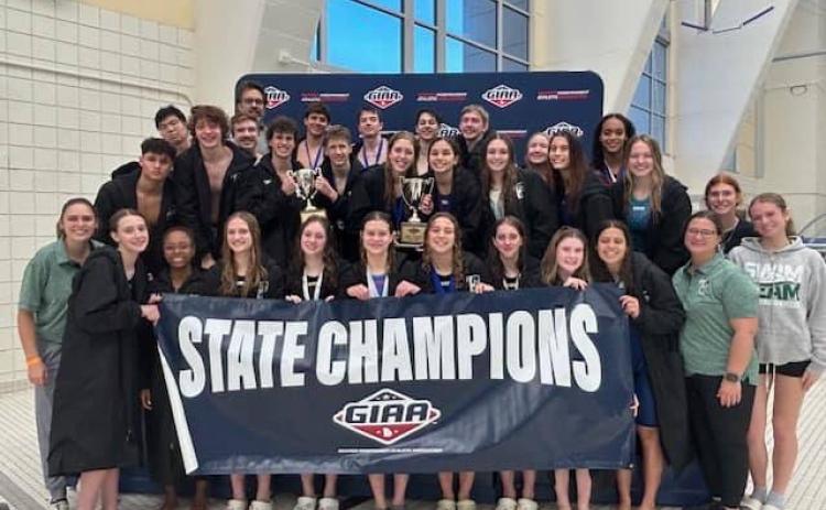 The TFS swim team poses after winning the state title in their first year as a member of GIAA. SUBMITTED