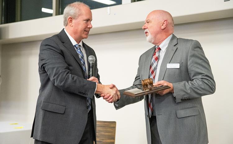 Past Chairman Tim Ash, right, passes the gavel to now-current Chairman Tommy Thurmond. ZACH TAYLOR/Staff