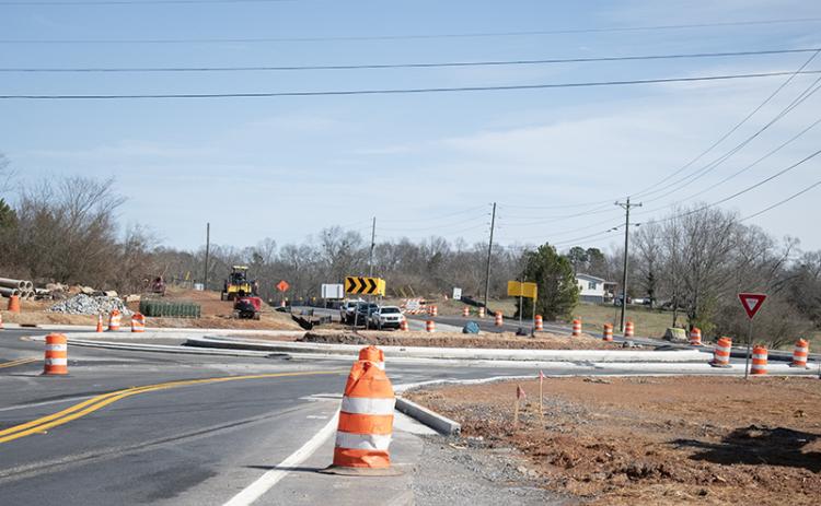 Construction on the roundabout at Ga. 115 and 105 is nearing completion, and Georgia Department of Transportation was ready to open the new lane merging into the roundabout Friday morning. HANNAH CAUDELL/Staff